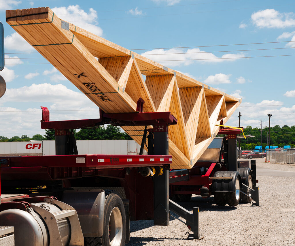 A stack of trusses bundled together on a large trailer